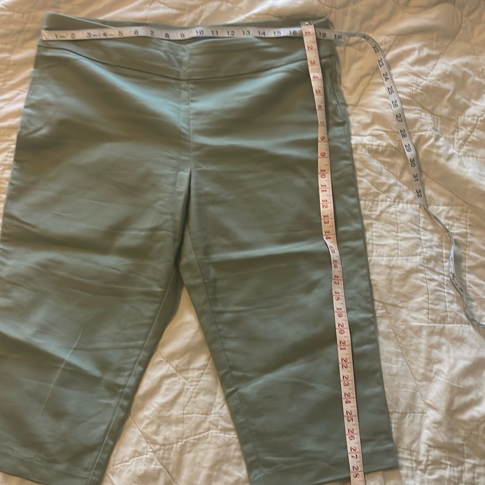 Sage green pull-on capri pants with faux front pockets